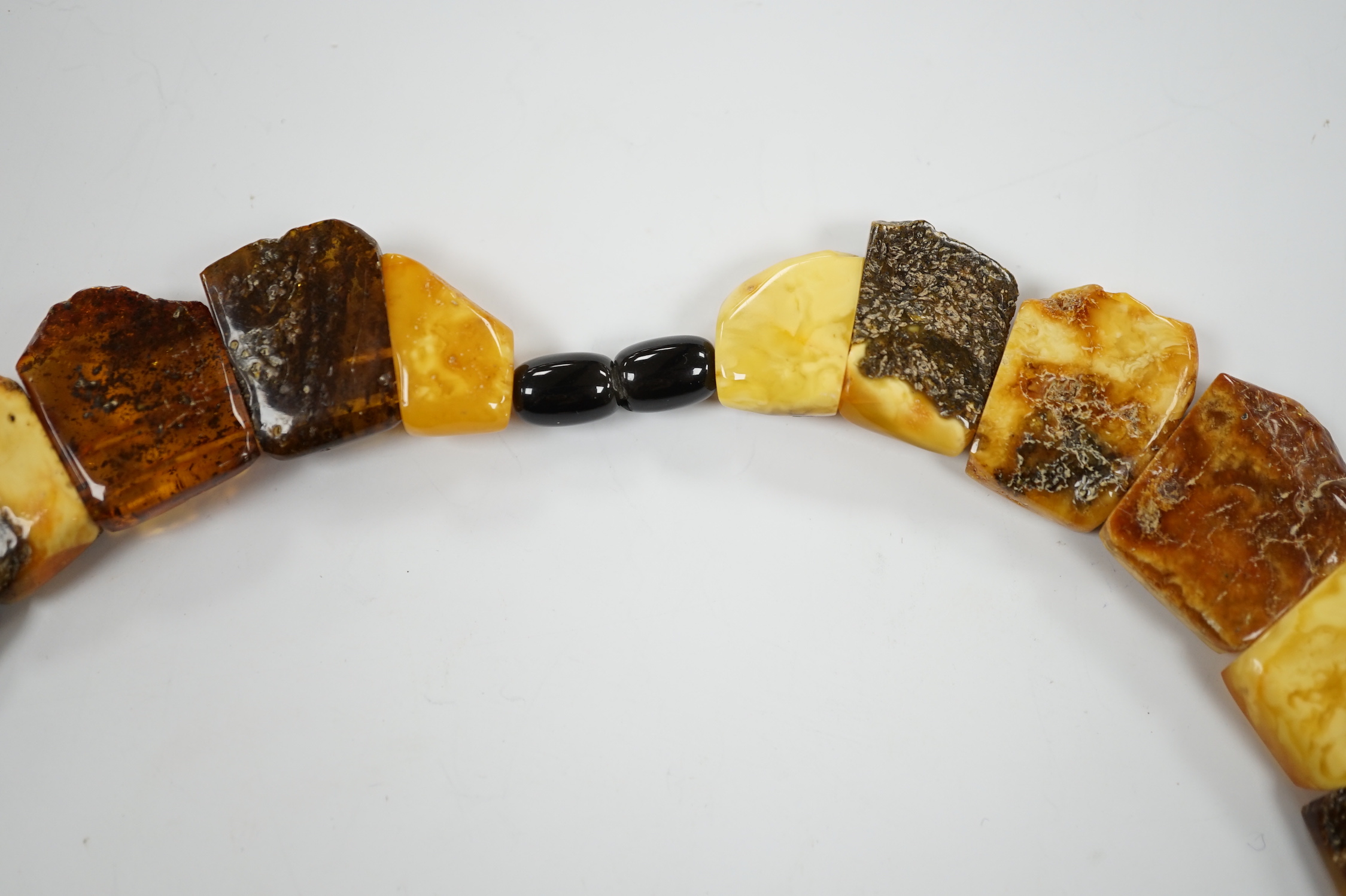 A contemporary Baltic amber fringe necklace, 46cm, gross weight 72 grams.